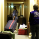 An African migrant domestic worker pushes her luggage at a Beirut hotel as she prepares to travel back to her country. Oct. 5, 2020. .